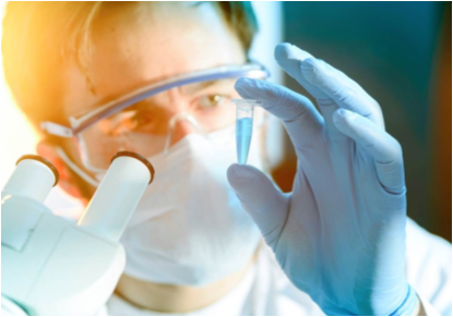 Scientist examining liquid in microcentrifuge tube